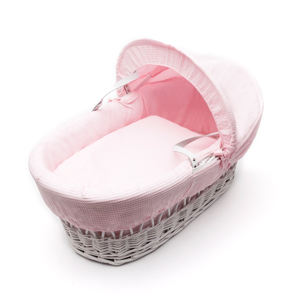 pink moses basket with stand